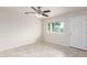 Well-lit bedroom featuring neutral walls, tile flooring, and a ceiling fan at 1852 N Grand St, Mesa, AZ 85201