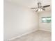 This bedroom features neutral walls, tile flooring and a ceiling fan with light fixture at 1852 N Grand St, Mesa, AZ 85201