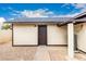 Exterior of the home showcases a side door entrance and neutral siding at 1852 N Grand St, Mesa, AZ 85201