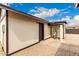 Exterior of home with dark brown trim and neutral siding; includes a water heater at 1852 N Grand St, Mesa, AZ 85201