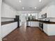 Modern kitchen with stainless steel appliances and white cabinets at 19973 E Thornton Rd, Queen Creek, AZ 85142