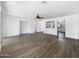 Open living room with modern floors that lead into a kitchen area at 19973 E Thornton Rd, Queen Creek, AZ 85142