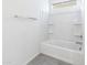 Clean and bright bathroom featuring a tiled bathtub and shower combination at 2181 N 211Th Dr, Buckeye, AZ 85396