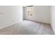 Bright bedroom features neutral carpet, white walls, and a window for natural light at 2181 N 211Th Dr, Buckeye, AZ 85396
