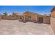 Large backyard area with desert landscape and a covered patio at 22010 W Solano Dr, Buckeye, AZ 85326