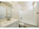 Clean, well-lit bathroom with a modern vanity, mirror, and a bathtub-shower combo at 22010 W Solano Dr, Buckeye, AZ 85326