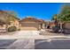 Charming single-story home with a two-car garage, desert landscaping, and a well-maintained front yard at 22010 W Solano Dr, Buckeye, AZ 85326