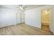 Spacious main bedroom with modern flooring, ceiling fan, and an en-suite bathroom at 22010 W Solano Dr, Buckeye, AZ 85326