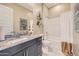 Well-lit bathroom features a shower and a sleek vanity at 23134 E Nightingale Rd, Queen Creek, AZ 85142