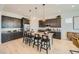 Modern kitchen with an island, pendant lighting, and stainless steel appliances at 23134 E Nightingale Rd, Queen Creek, AZ 85142