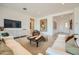 Bright and inviting living room featuring comfortable seating and contemporary decor at 23134 E Nightingale Rd, Queen Creek, AZ 85142