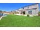 Green backyard features artificial grass, water feature, and basketball hoop at 24314 N 21St Pl, Phoenix, AZ 85024