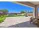 View of backyard with artificial grass, a water feature, and basketball hoop at 24314 N 21St Pl, Phoenix, AZ 85024