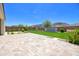 Spacious backyard with artificial grass, water feature, and desert landscaping at 24314 N 21St Pl, Phoenix, AZ 85024