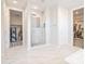 Stylish bathroom featuring walk-in shower, laundry room and access to a walk-in closet providing modern convenience at 24314 N 21St Pl, Phoenix, AZ 85024