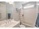 Bathroom featuring white vanity and shower/tub combo at 24314 N 21St Pl, Phoenix, AZ 85024