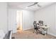 Neutral bedroom space featuring a ceiling fan and a desk for work or study at 24314 N 21St Pl, Phoenix, AZ 85024