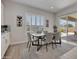 Stylish dining room with access to the backyard patio, perfect for indoor-outdoor entertaining at 24314 N 21St Pl, Phoenix, AZ 85024