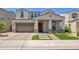 Charming two-story home featuring a well-manicured front yard, covered entryway, and a spacious two-car garage at 24314 N 21St Pl, Phoenix, AZ 85024