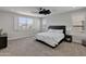 Serene primary bedroom with large windows and plush carpet provides a relaxing retreat at 24314 N 21St Pl, Phoenix, AZ 85024
