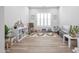 Bright playroom with a large window, hardwood floors, and white walls offering versatile space for activities at 24314 N 21St Pl, Phoenix, AZ 85024