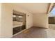Covered back patio features desert landscaping views through sliding glass door at 2625 E Beverly Rd, Phoenix, AZ 85042