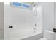 Clean, white bathroom with a shower-tub combo, perfect for a refreshed, modern look at 2625 E Beverly Rd, Phoenix, AZ 85042