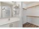 A modern bathroom with a bright vanity and walk in closet at 2625 E Beverly Rd, Phoenix, AZ 85042