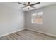 A peaceful bedroom featuring wood-look flooring and a ceiling fan at 2625 E Beverly Rd, Phoenix, AZ 85042