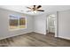 Bright, airy bedroom with hard surface floors, en-suite bath, and natural lighting at 2625 E Beverly Rd, Phoenix, AZ 85042