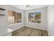 Well-lit dining area with wood-style floors, views of the neighborhood, and a modern ceiling light at 2625 E Beverly Rd, Phoenix, AZ 85042