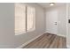 Entryway featuring wood-look flooring and a large window offering natural light at 2625 E Beverly Rd, Phoenix, AZ 85042