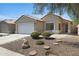 Well-maintained single-story home with a two-car garage and rock landscaping at 2625 E Beverly Rd, Phoenix, AZ 85042