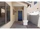 Inviting front porch with a blue door and brick flooring at 2625 E Beverly Rd, Phoenix, AZ 85042