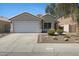 Charming single-story home with a two-car garage and low-maintenance desert landscaping at 2625 E Beverly Rd, Phoenix, AZ 85042