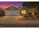 Charming single-story home showcasing a manicured front yard and attached two-car garage at 2625 E Beverly Rd, Phoenix, AZ 85042
