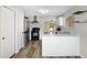 Bright kitchen with stainless steel appliances, a breakfast bar, and open shelving at 2625 E Beverly Rd, Phoenix, AZ 85042