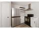 Well-equipped kitchen featuring stainless steel appliances and minimalist design at 2625 E Beverly Rd, Phoenix, AZ 85042