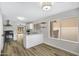 Spacious kitchen and dining area showcasing updated appliances, sleek countertops, and ample natural light at 2625 E Beverly Rd, Phoenix, AZ 85042