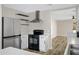 Functional kitchen with stainless steel refrigerator and black stove at 2625 E Beverly Rd, Phoenix, AZ 85042