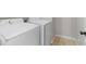 Bright laundry room features a full-sized washer and dryer at 2625 E Beverly Rd, Phoenix, AZ 85042