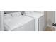 Laundry room with side-by-side Samsung washer and dryer at 2625 E Beverly Rd, Phoenix, AZ 85042