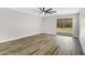 Spacious living room with updated flooring, neutral paint, and a sliding glass door to the backyard at 2625 E Beverly Rd, Phoenix, AZ 85042