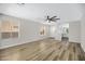 Inviting living room features modern floors, neutral colors, and access to kitchen and entry for convenience at 2625 E Beverly Rd, Phoenix, AZ 85042