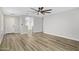 Open-concept living room with wood floors and a ceiling fan at 2625 E Beverly Rd, Phoenix, AZ 85042