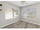 Bright office space with two windows and wood-look flooring at 2625 E Beverly Rd, Phoenix, AZ 85042