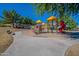 Community playground with play structures, benches and a well-maintained play area for children at 2625 E Beverly Rd, Phoenix, AZ 85042