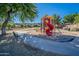 Colorful community playground with slides and climbing structures surrounded by green space and walkways at 2625 E Beverly Rd, Phoenix, AZ 85042