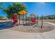 Community playground featuring multiple climbing and sliding structures in a well-maintained sandy area at 2625 E Beverly Rd, Phoenix, AZ 85042