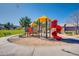 Community playground with climbing and sliding equipment, surrounded by lush grass at 2625 E Beverly Rd, Phoenix, AZ 85042